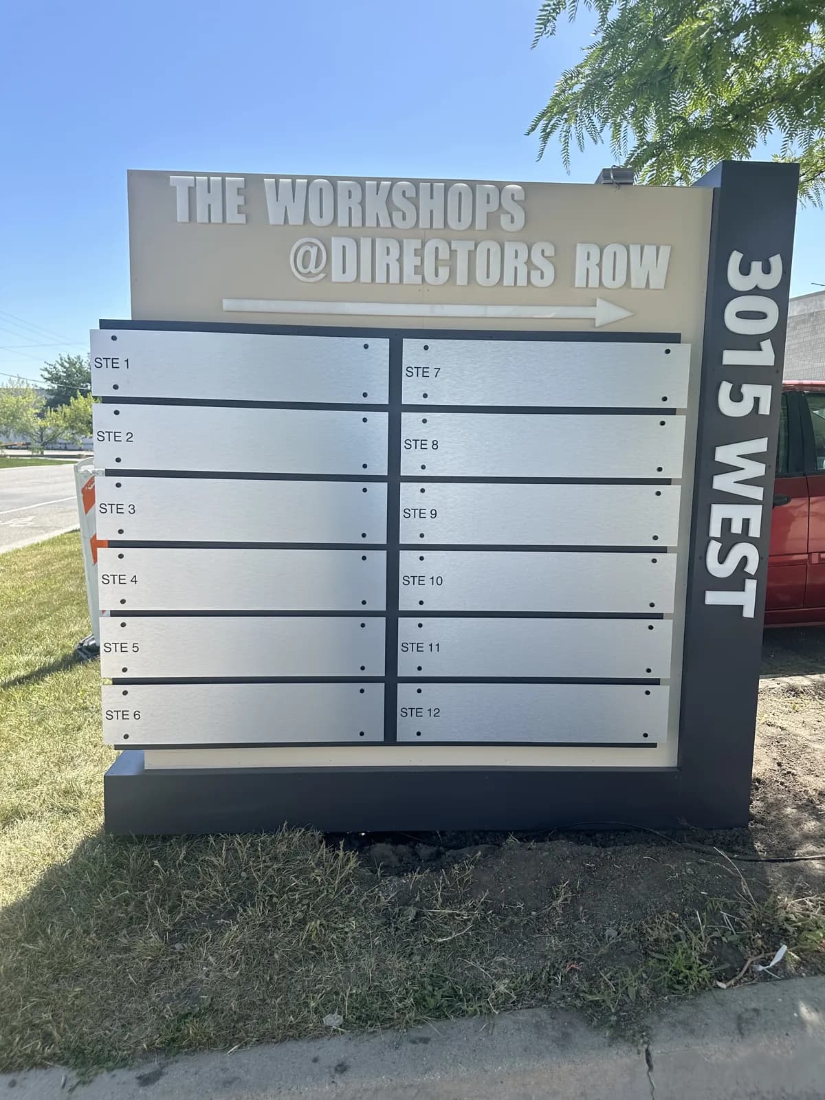The Workshops @ Directors Row — Tenant Directory Sign — Brushed-Aluminum Directory with Changeable Slats