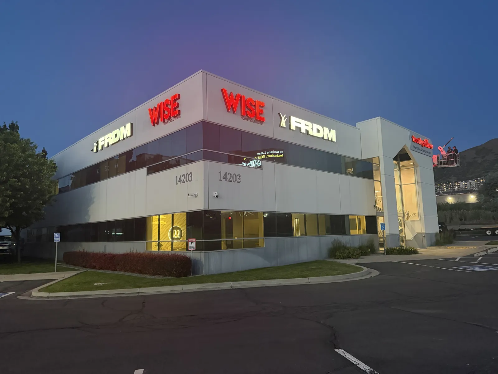WISE & FRDM — Building Letters, Lit at Night — Illuminated Building-Mounted Letter Sets